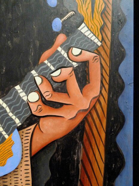detail of the cubist style fingers of a painted guitarist