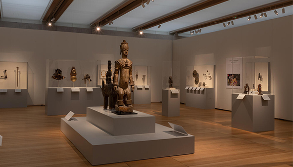 Installation view of African art and sculpture in a museum