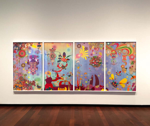 Psychedelic, multi-colored and multi-paneled work hanging on the wall