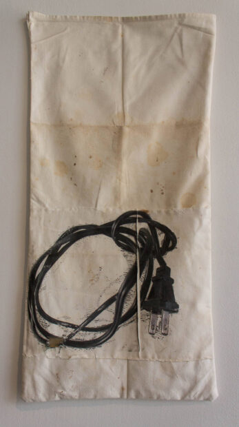 A print of an extension cord on a piece of fabric.