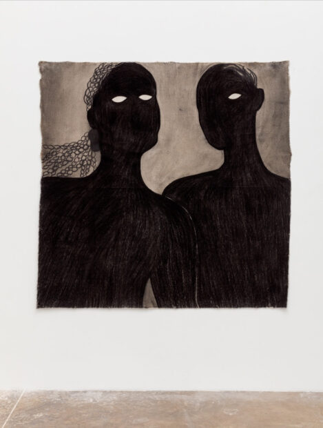 A large scale charcoal work by taylor barnes that depicts two dark figures.
