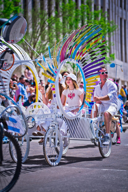 A photograph of an art bike participating in the Art Car Parade. 