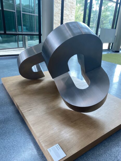 Photo of a large, curved, steel public sculpture