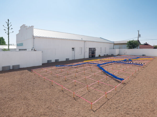 Installation photo of a yard measured off in square plots