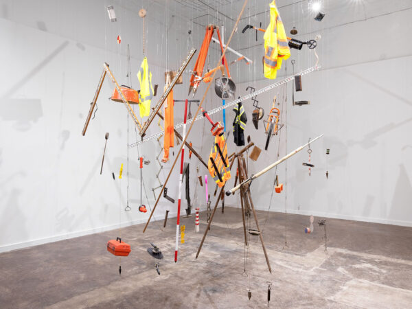 Installation view of a mixed media sculpture suspended in space