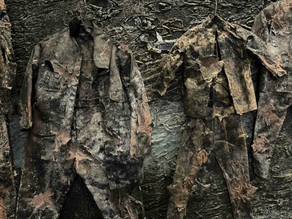 Detail of a site specific installation of children's clothing by Anselm Kiefer