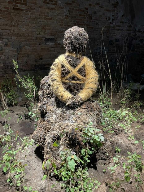 Installation of a figure made of dirt