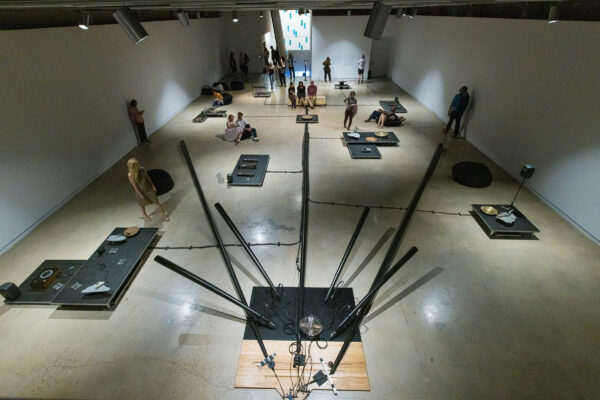 Photo of viewers interacting with three dimensional sound objects in a gallery space