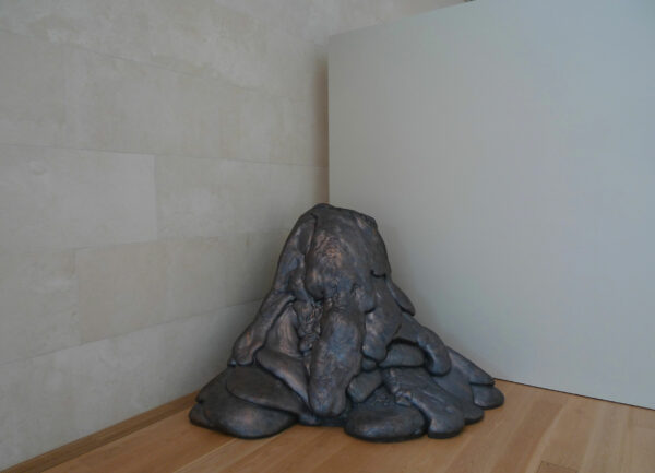 Image of a bronze blob in a corner