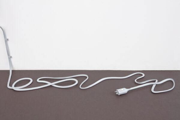 White power cable lying on the floor
