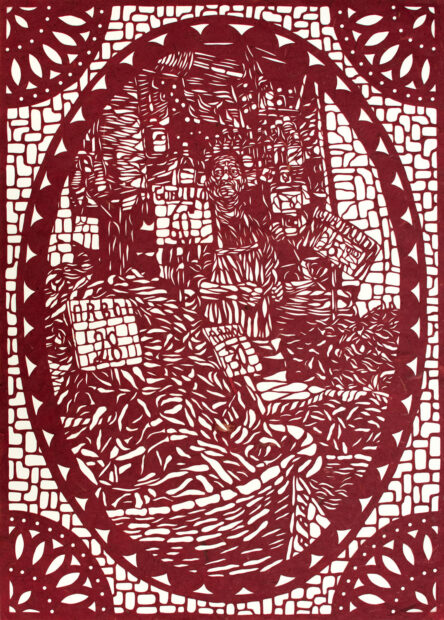An intricately cut paper piece by Guadalupe Hernandez depicting a figure at a market with baskets around him. The figure is framed by a tall oval shape and the edges of the rectangular piece have quarter circles in them.
