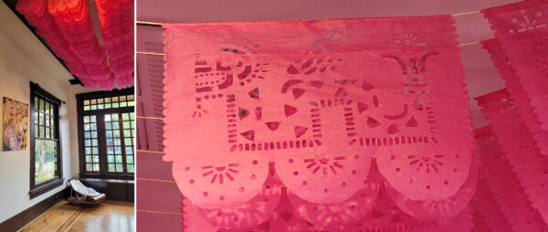 Detail images of pink papel picado hanging from a ceiling