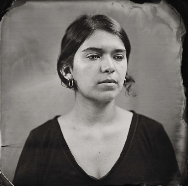A black and white tintype photograph of a young woman by Keliy Anderson Staley.