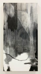 An abstract work by Nishiki Sugawara-Beda using black Sumi ink on wood which has been painted white.