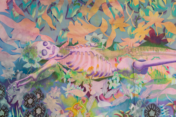 A detail of a large painting in paint and colored pencil features a pink skeleton laying on its back with various flowers and foliage arrange beneath, beside and above the skeleton.