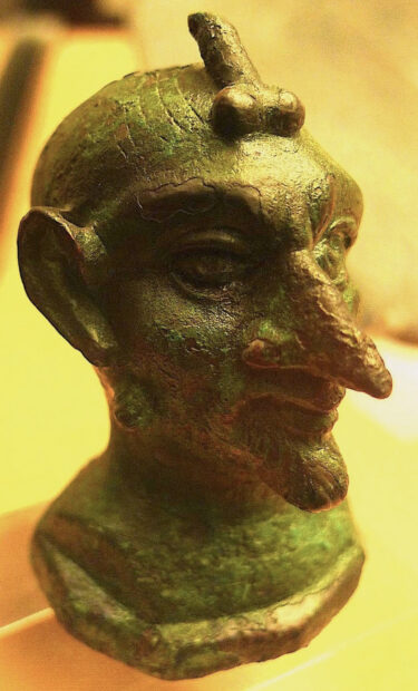 Bronze devil head with phallic details