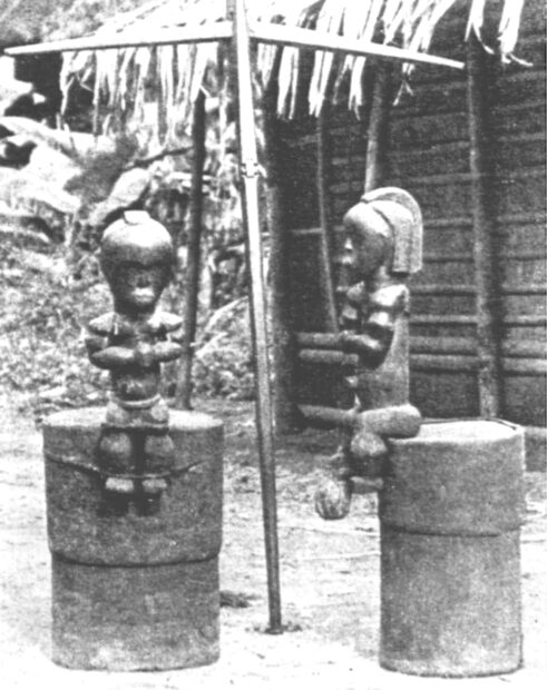Photo of two seated reliquary figures
