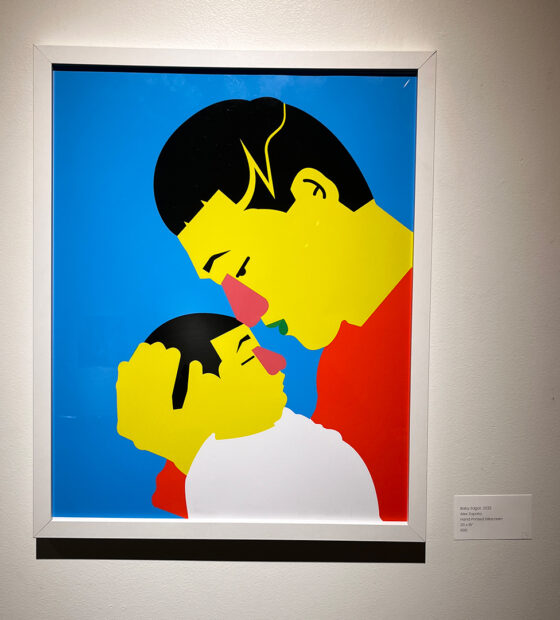 A silkscreen print of a father cradling his young son. Artwork by Alex Zapata.