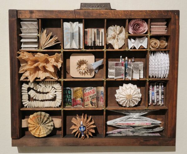 A cabinet of curiosities with objects made of paper
