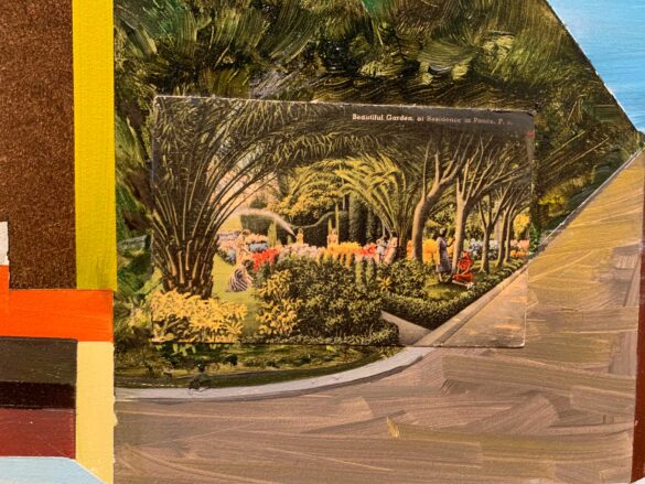 A postcard picturing lush gardens sits on top of a panel that has been painted to match the postcard's photograph.