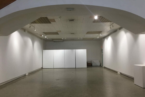 A photograph of the inside of a an empty gallery at BOX13 ArtSpace in Houston.