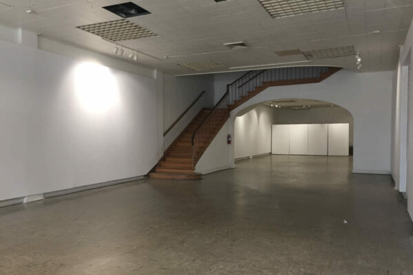 A photograph of the inside of a an empty gallery at BOX13 ArtSpace in Houston.