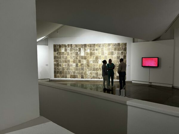 Exhibition view with work by Veronica Gaona in the background
