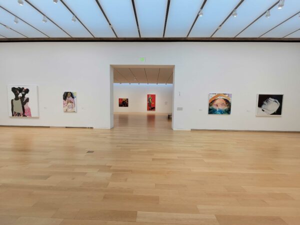 Installation view of large scale paintings on a white wall