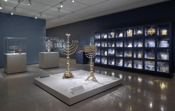 Installation view of a gallery full of Menorahs