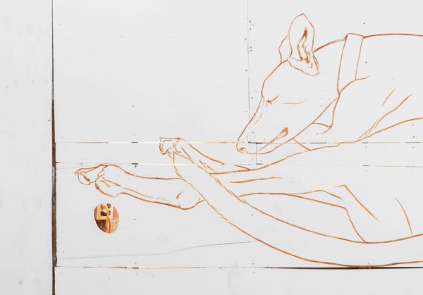 Line drawing of a greyhound on a white wall
