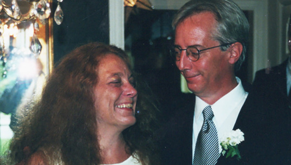 Fran and her husband Donnie smiling at their wedding
