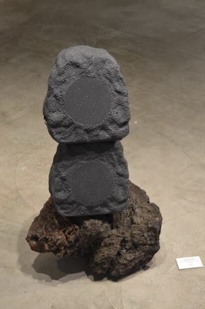 Three stones stacked on top of each other on the floor
