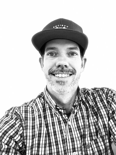 A black and white headshot of artist and gallery manager Zach Morriss.