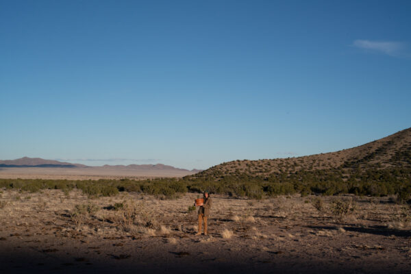 Photo of the author standing in the middle of the desert landscape