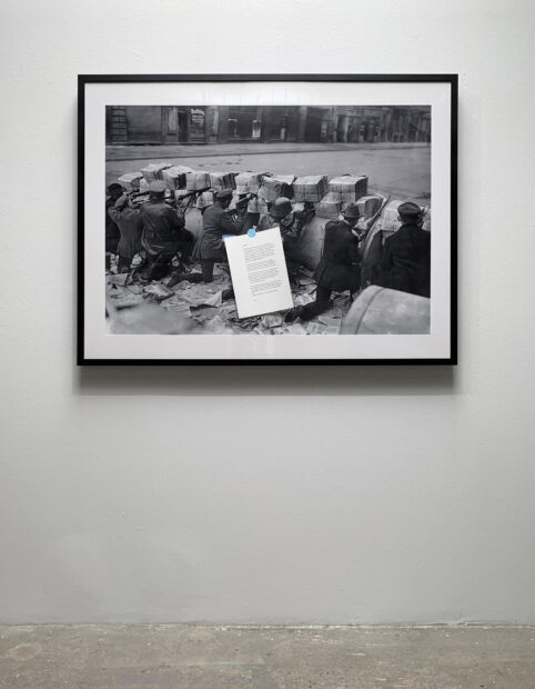 Installation view of a black and white photo on a wall
