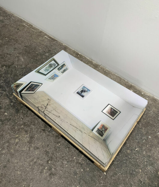 Photo of a stack of images on the floor