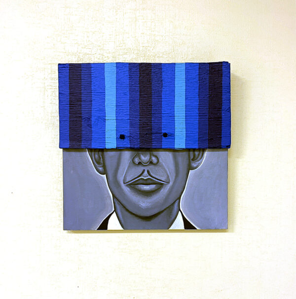 A mixed-media work by Alejandro Macias depicting a black and white portrait of his grandfather which is partially covered by a wood panel painted with vertical blue stripes.