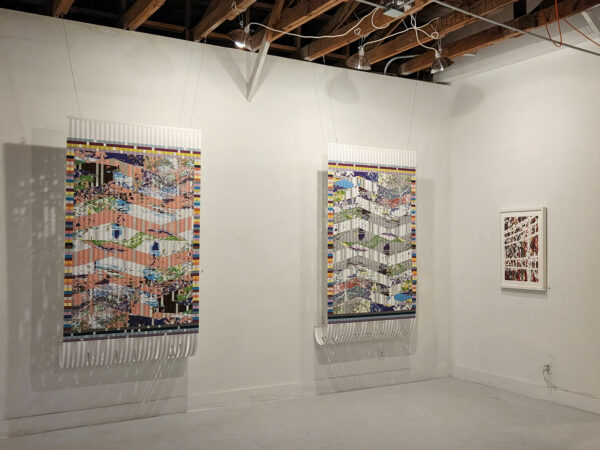 Installation view with three hand cut works on paper suspended in the gallery space