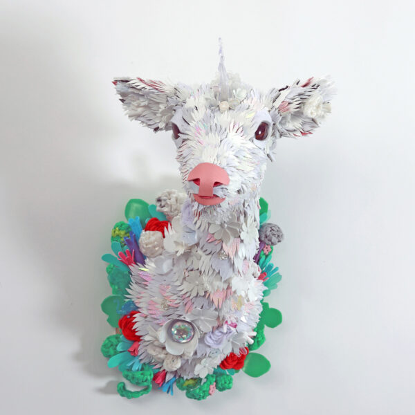 Photo of a white unicorn head made of upcycled plastics
