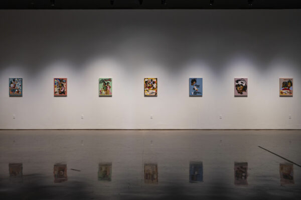 Installation view of 7 paintings on a white wall