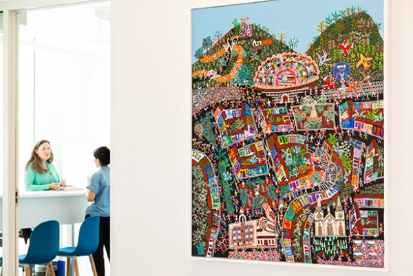 An installation image of a large-scale colorful painting by Gerardo Rosales.