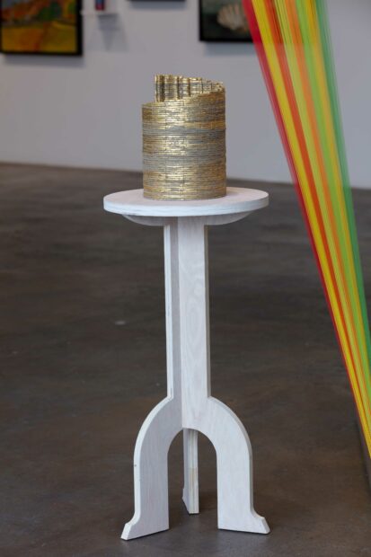 Installation view with string and an unfinished puzzle of the Tower of Piza