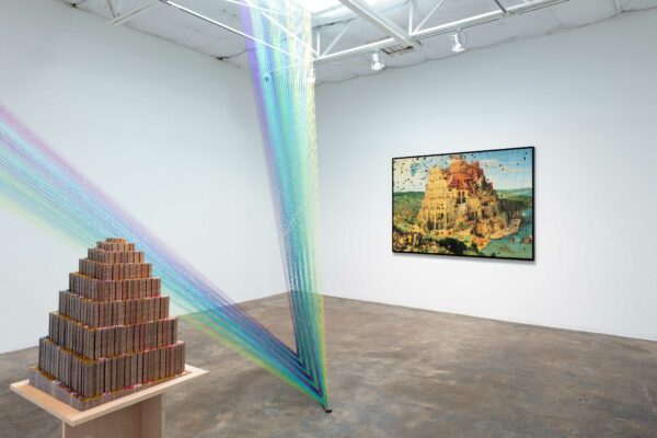 Installation view with string from floor to ceiling and an unfinished puzzle