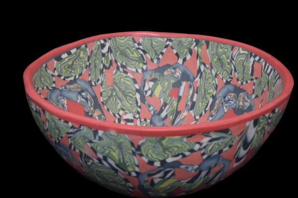 A ceramic bowl with patterned clay.