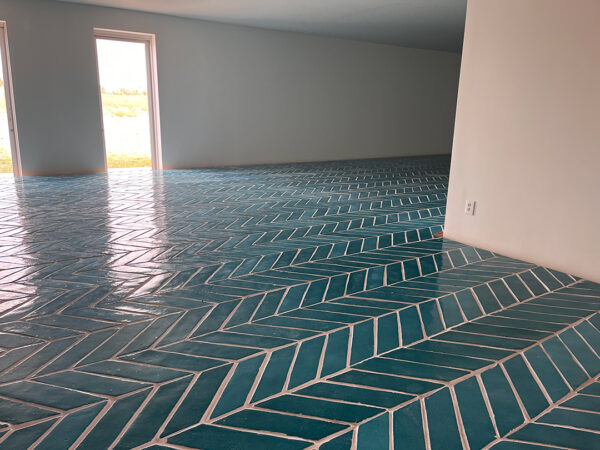 A photograph of a blue tiled floor by Sarah Crowner installed at the Chinati Foundation in Marfa.