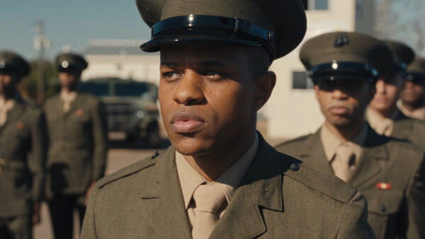 A still image from Elegance Bratton’s film "The Inspection." The still image is a close-up on a solider's face as he stands in formation among other soldiers. 