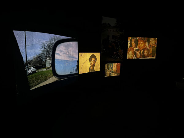 Installation of video and photos in a black room