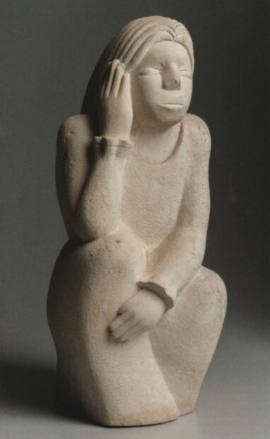 Photo of a sculpture of a seated woman