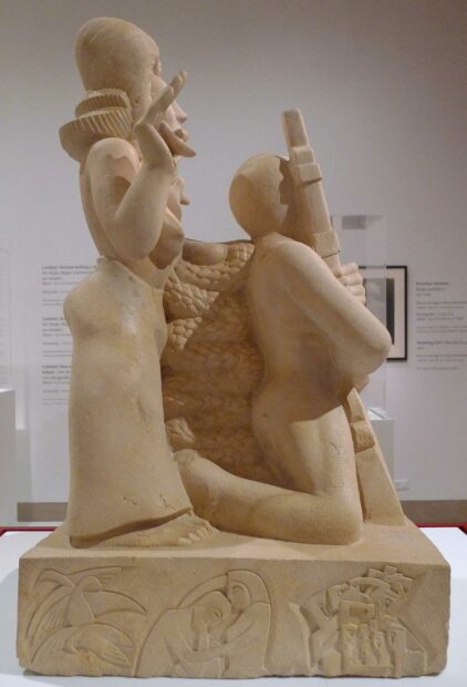 Image of a detail of a sculpture of a woman and a man holding a rifle