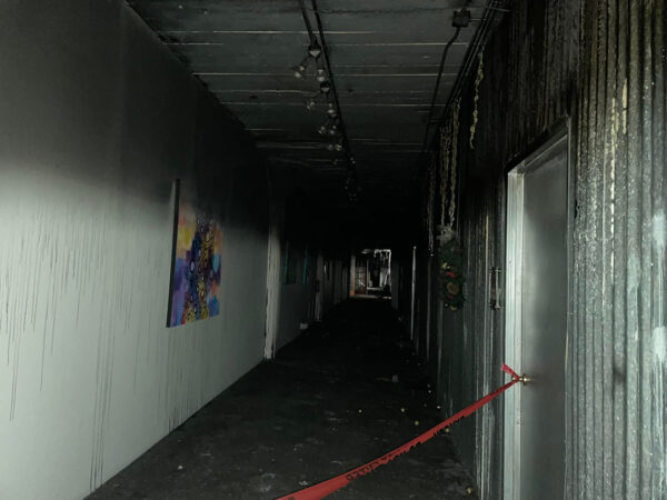 A photograph of the fire-damaged hallway inside Winter Street Studios.